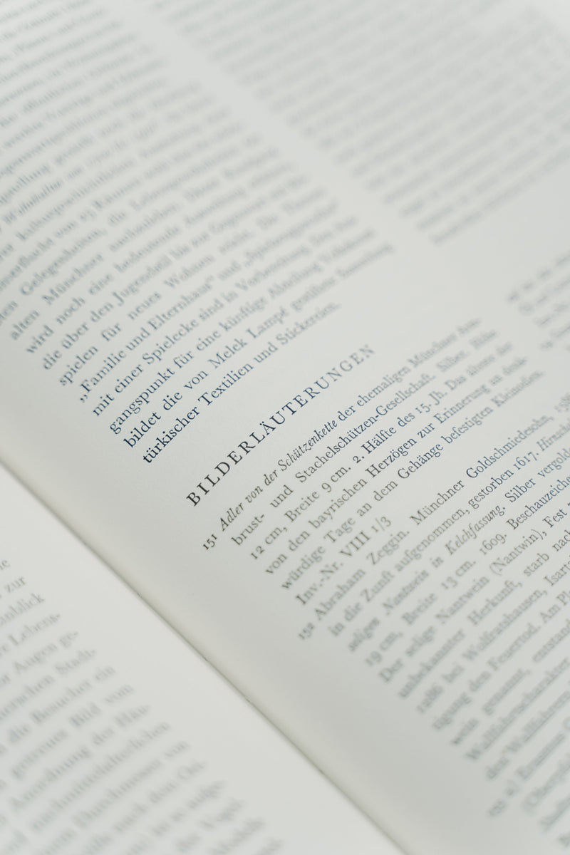 Close-up of an open book with the printed text block and page margins in focus