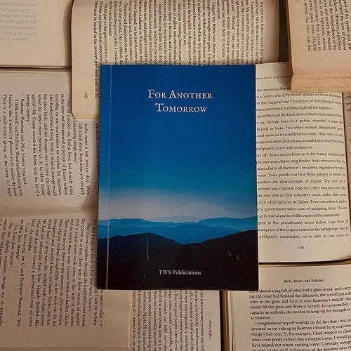Book with a blue cover titled 'For Another Tomorrow' by TWS Publications on an open book background.
