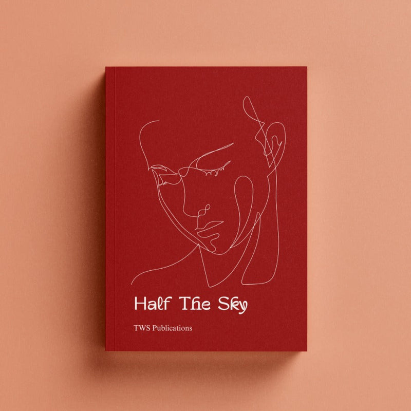 Red book titled 'Half The Sky' with a face illustration on a peach background
