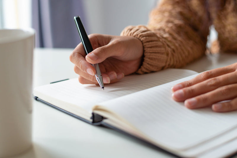 A writer planning at a table
